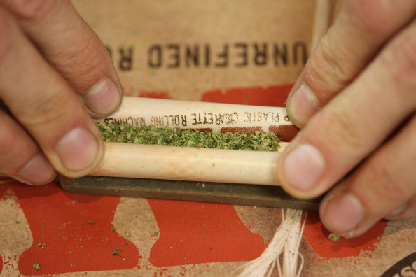 A budtender rolls a marijuana cigarette for a patient at Perennial Holistic Wellness Center medical marijuana dispensary, which opened in 2006, on July 25, 2012 in Los Angeles, California.