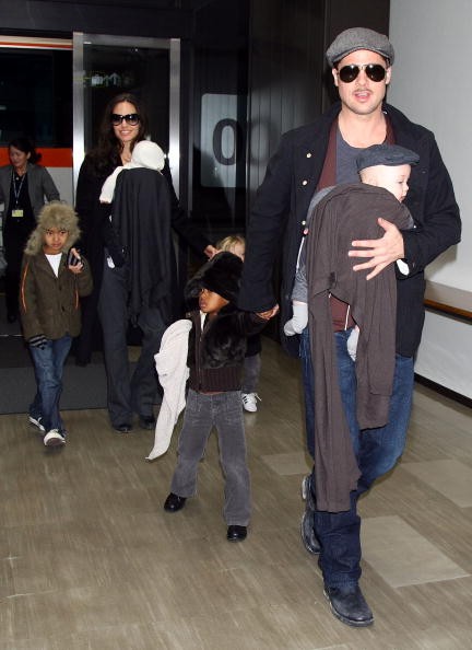 Actor Brad Pitt and Angelina Jolie arrive at Narita International Airport with their children (L to R) Maddox, Vivienne, Zahara and Knox on January 27, 2009 in Narita, Chiba, Japan. Brad is visiting Japan to promote his film 'The Curious Case Of Benjamin Button'