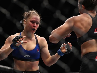 Ronda Rousey and Amanda Nunes of Brazil face off in their UFC women's bantamweight championship bout during the UFC 207 event at T-Mobile Arena on December 30, 2016 in Las Vegas, Nevada. 