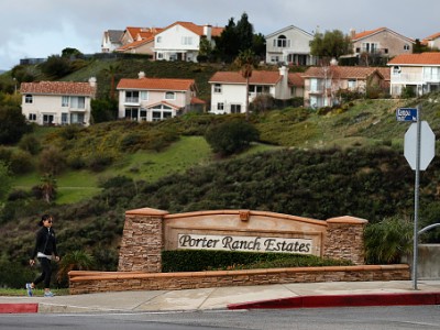 Eunice Kim passes the intersection of Hollow Springs Dr. and Tampa Ave while walking back to her home February 18, 2016 in Porter Ranch, California.