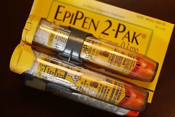 In this photo illustration, EpiPen, which dispenses epinephrine through an injection mechanism for people with severe allergies, is seen as the company that makes it Mylan Inc. has come under fire from consumers and lawmakers for the price that it is curr