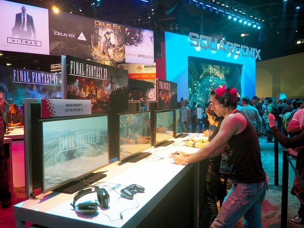 Visitors play Final Fantasy XV on the opening day of the E3, in Los Angeles on June 14, 2016. 