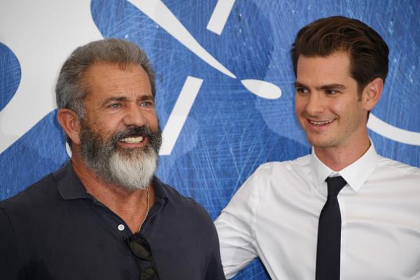 Director Mel Gibson and actor Andrew Garfield attended a photocall for "Hacksaw Ridge" during the 73rd Venice Film Festival at Palazzo del Casino on September 4 in Venice, Italy.