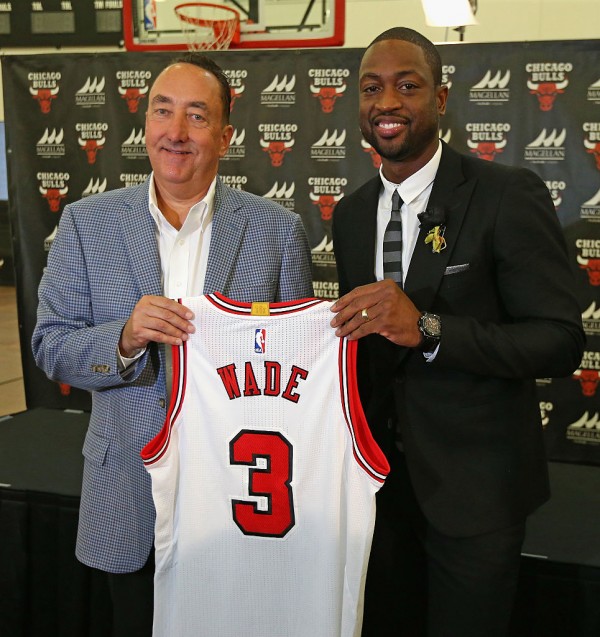 Chicago Bulls general manager Gar Forman (L) presents Dwyane Wade to media