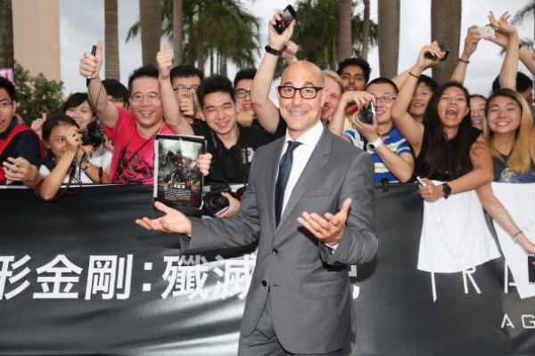 Stanley Tucci poses with fans at the worldwide premiere screening of "Transformers: Age of Extinction" at the on June 19, 2014 in Hong Kong, Hong Kong.