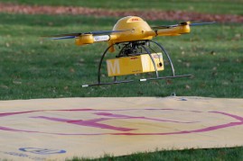 A quadcopter drone arrives with a small delivery at Deutsche Post headquarters on December 9, 2013 in Bonn, Germany. Deutsche Post is testing deliveries of medicine from a pharmacy in Bonn in an examination into the viability of using drones for deliverie