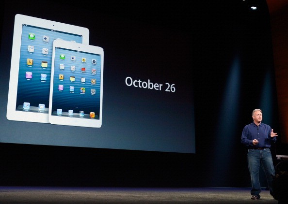 Apple Senior Vice President of Worldwide product marketing Phil Schiller displays the date when the new iPad mini and fourth generation iPad will be available to the public during an Apple special event at the historic California Theater on October 23, 20