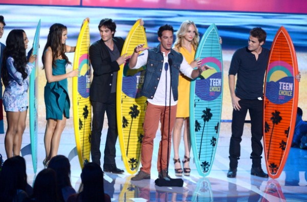 Actors Kat Graham, Nina Dobrev, Ian Somerhalder, Michael Trevino, Candice Accola, and Paul Wesley accept the Choice Fantasy/Sci-Fi Show award onstage during the 2012 Teen Choice Awards at Gibson Amphitheatre on July 22, 2012 in Universal City, California.