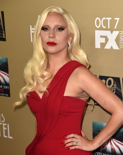 "Perfect Illusion" singer Lady Gaga stunning in red dress during the premiere screening of "American Horror Story: Hotel" in Los Angeles.