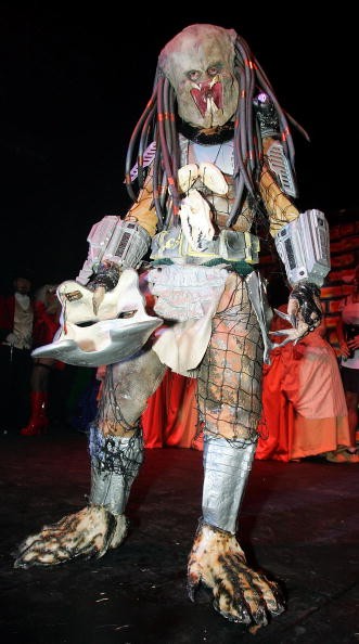 A reveler dressed as the alien character from the movie 'Predator' competed in a costume contest during the 10th annual Fetish & Fantasy Halloween Ball at the Las Vegas Sports Center on Oct. 29, 2005.