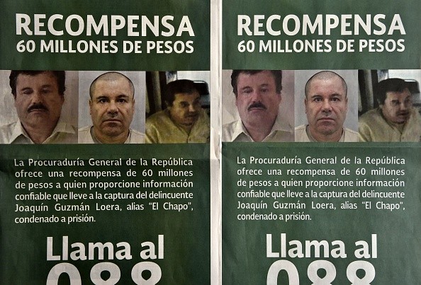 Photo of notices published in newspapers offering 60 million Mexican pesos (3.8 USD approximately) reward to anyone with information leading to the recapture of Joaquin 'El Chapo' Guzman Loera in Mexico City on July 16, 2015. 