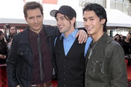 Actors Peter Facinelli (L-R), Jackson Rathbone and Booboo Stewart pose as several cast members visit fans camping out for the premiere of ''The Twilight Saga: Breaking Dawn Part - 1'' in Los Angeles, California November 13, 2011.