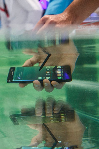 A visitor tests the waterproof S7 from Samsung at the 2016 IFA consumer electronics trade fair in Berlin, Germany.