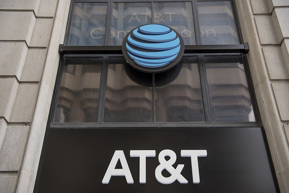 Signage is displayed outside the new AT&T Inc. flagship store in San Francisco, California, U.S., on Thursday, Sept. 15, 2016. The store will officially open to customers on September 28. 