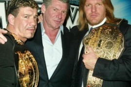 Wrestler Eddie Guerrero, WWE Chairman Vince McMahon and Wrestler Triple H attend a press conference to promote Wrestlemania XX at Planet Hollywood March 11, 2004 in New York City. 