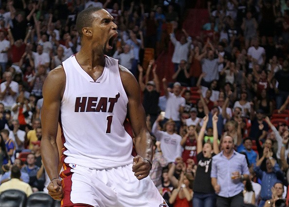 Chris Bosh of the Miami Heat reacts to a play during a game against the Houston Rockets on November 1, 2015 in Miami, Florida. 