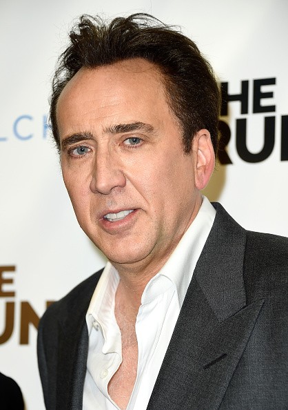 Actor Nicolas Cage arrived at the Paper Street Films' Screening Of “The Runner” at TCL Chinese 6 Theatres on August 5, 2015 in Hollywood, California.