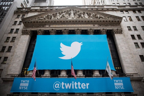 The Twitter logo is displayed on a banner outside the New York Stock Exchange (NYSE) on November 7, 2013 in New York City. Twitter goes public on the NYSE today and is expected to open at USD 26 per share, making the company worth an estimated USD 18 bill