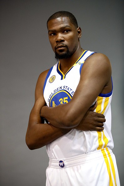 Kevin Durant of the Golden State Warriors poses for photographers during the Golden State Warriors Media Day at the Warriors Practice Facility on September 26, 2016 in Oakland, California.