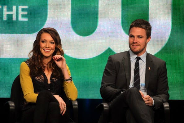  Katie Cassidy (L) and Stephen Amell speaks at the 'Arrow' discussion panel during the CW portion of the 2012 Summer Television Critics Association tour at the Beverly Hilton Hotel on July 30, 2012 in Los Angeles, California. 
