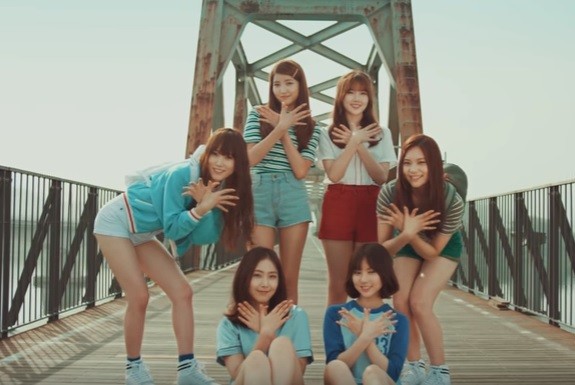 G-Friend poses for the official music video of their song "NAVILLERA."