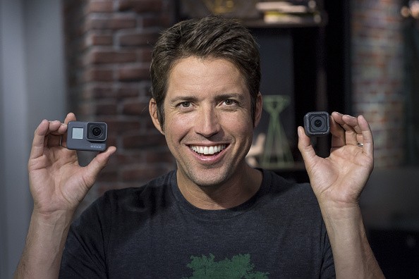 The image shows the GoPro Inc. CEO, Nick Woodman holding the GoPro Hero5 Black on the left and GoPro Hero5 Session on the right. 