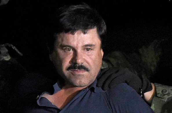 Drug kingpin Joaquin 'El Chapo' Guzman is escorted into a helicopter at Mexico City's airport on January 8, 2016 following his recapture during an intense military operation in Los Mochis, in Sinaloa State.
