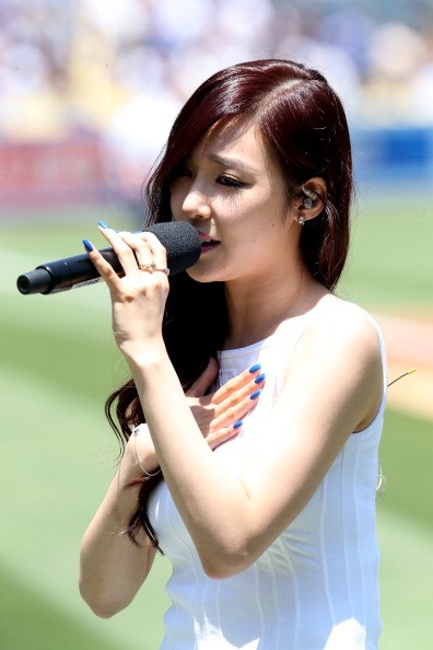 Girls' Generation's Tiffany sings before a game between the Cincinnati Reds and the Los Angeles Dodgers.