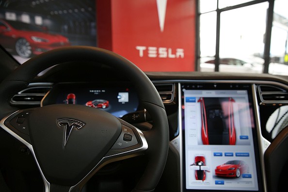 The inside of a Tesla vehicle is viewed as it sits parked in a new Tesla showroom and service center in Red Hook, Brooklyn on July 5, 2016 in New York City. T