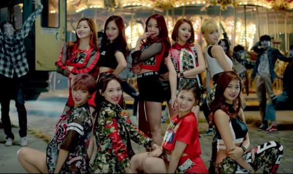 TWICE members in the official music video of "Like OOH-AHH."