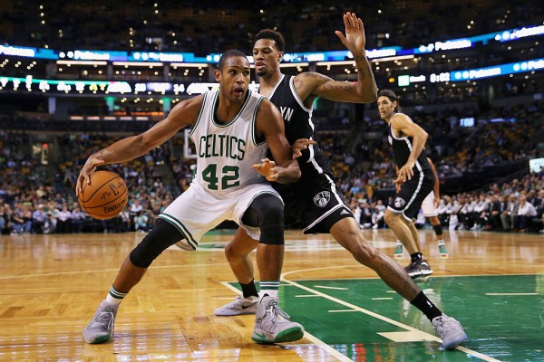 Boston Celtics center Al Horford (L) posts up against Brooklyn Nets' Chris McCullough