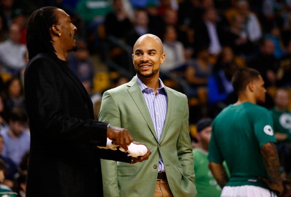 Jerryd Bayless and Gerald Wallace of the Boston Celtics talk near the bench during a timeout against the Washington Wizards in the second half during the game at TD Garden on April 16, 2014 in Boston, Massachusetts. 