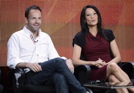 Cast members Jonny Lee Miller (L) and Lucy Liu participate in a panel for CBS series ''Elementary'' during the CBS sessions at the Television Critics Association summer press tour in Beverly Hills, California July 29, 2012.