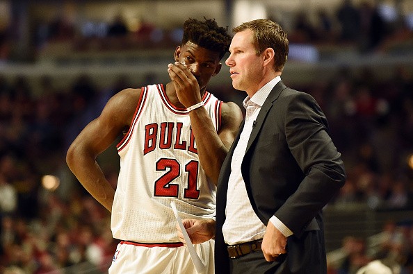 Jimmy Butler of the Chicago Bulls speaks with head coach Fred Hoiberg during the first half of a game against the Boston Celtics at the United Center on October 27, 2016 in Chicago, Illinois. 