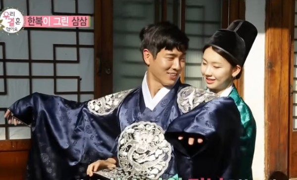 Jin Kyung seemingly gives Jota a back hug while helping him on his dress in the recent episode of "We Got Married."