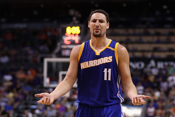 Klay Thompson #11 of the Golden State Warriors reacts during the NBA game against the Phoenix Suns.