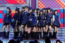  A Japanese idol group performs on stage.