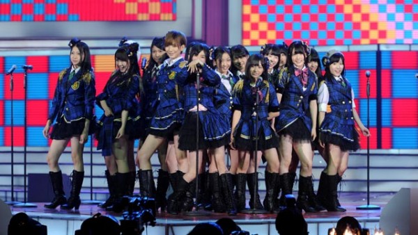   A Japanese idol group performs on stage.