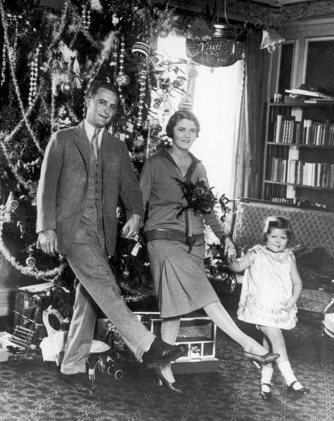 American author F Scott Fitzgerald (1896-1940) danced with his wife Zelda Fitzgerald (nee Sayre) (1900-1948) and daughter Frances (aka 'Scottie') in front of the Christmas tree in Paris.