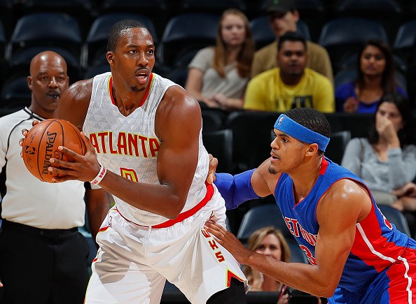 Dwight Howard #8 of the Atlanta Hawks looks to drive against Tobias Harris #34 of the Detroit Pistons at Philips Arena on October 13, 2016 in Atlanta, Georgia. 