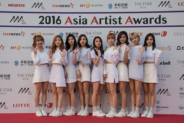 South Korean K-pop group 'Twice' pose on the red carpet of the '2016 Asia Artist Awards' in Seoul on November 16, 2016. 