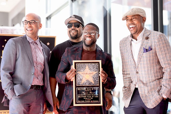 Director Tim Story, rapper/actor Ice Cube, actor/comedian Kevin Hart, and producer Will Packer posed for a photo as Kevin Hart honored with a star on the Hollywood Walk of Fame on Oct. 10 in Hollywood, California.