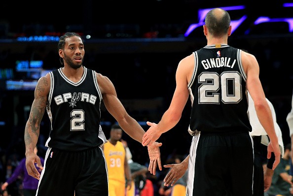 Kawhi Leonard #2 congratulates Manu Ginobili #20 of the San Antonio Spurs after defeating the Los Angeles Lakers 116-107 during a game at Staples Center on November 18, 2016 in Los Angeles, California. 