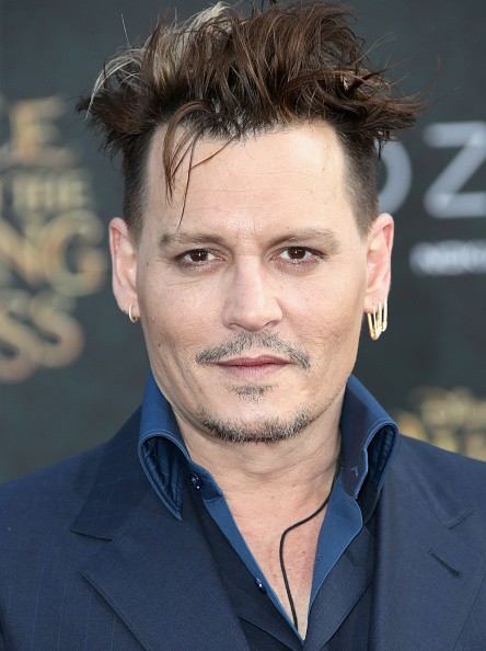Actor Johnny Depp attended the premiere of Disney's "Alice Through The Looking Glass" at the El Capitan Theatre on May 23 in Hollywood, California.