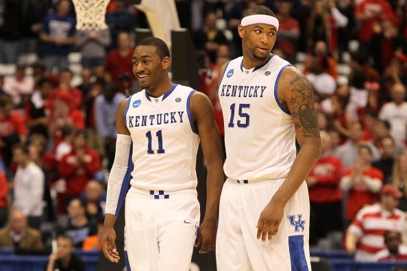 John Wall #11 and DeMarcus Cousins #15 of the Kentucky Wildcats react late in the second half against the Cornell Big Red during the east regional semifinal of the 2010 NCAA men's basketball tournament at the Carrier Dome on March 25, 2010 in Syracuse, Ne
