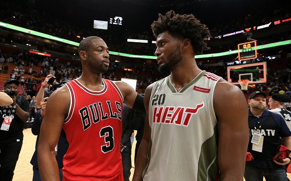 Dwyane Wade #3 of the Chicago Bulls talks with Justise Winslow #20 of the Miami Heat after the game at American Airlines Arena on November 10, 2016 in Miami, Florida. 
