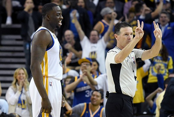 Draymond Green #23 of the Golden State Warriors complains to official Pat Fraher #26 after Fraher called a technical foul on Green against the San Antonio Spurs during the third quarter in an NBA basketball game at ORACLE Arena on October 25, 2016 Oakland