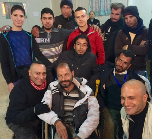 Canadian comedian Russell Peters with entertainers and comedians at a refugee camp in Jordan