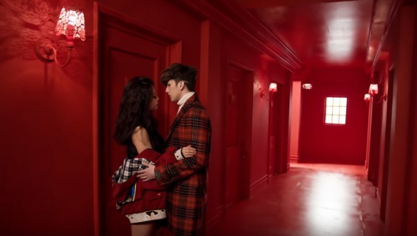 KPop stars Thunder and Goo Hara on the music video of their song 'Sign'.