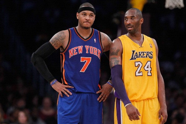 Carmelo Anthony #7 of the New York Knicks and Kobe Bryant #24 of the Los Angeles Lakers talk during the first half at Staples Center on December 29, 2012 in Los Angeles, California. 
